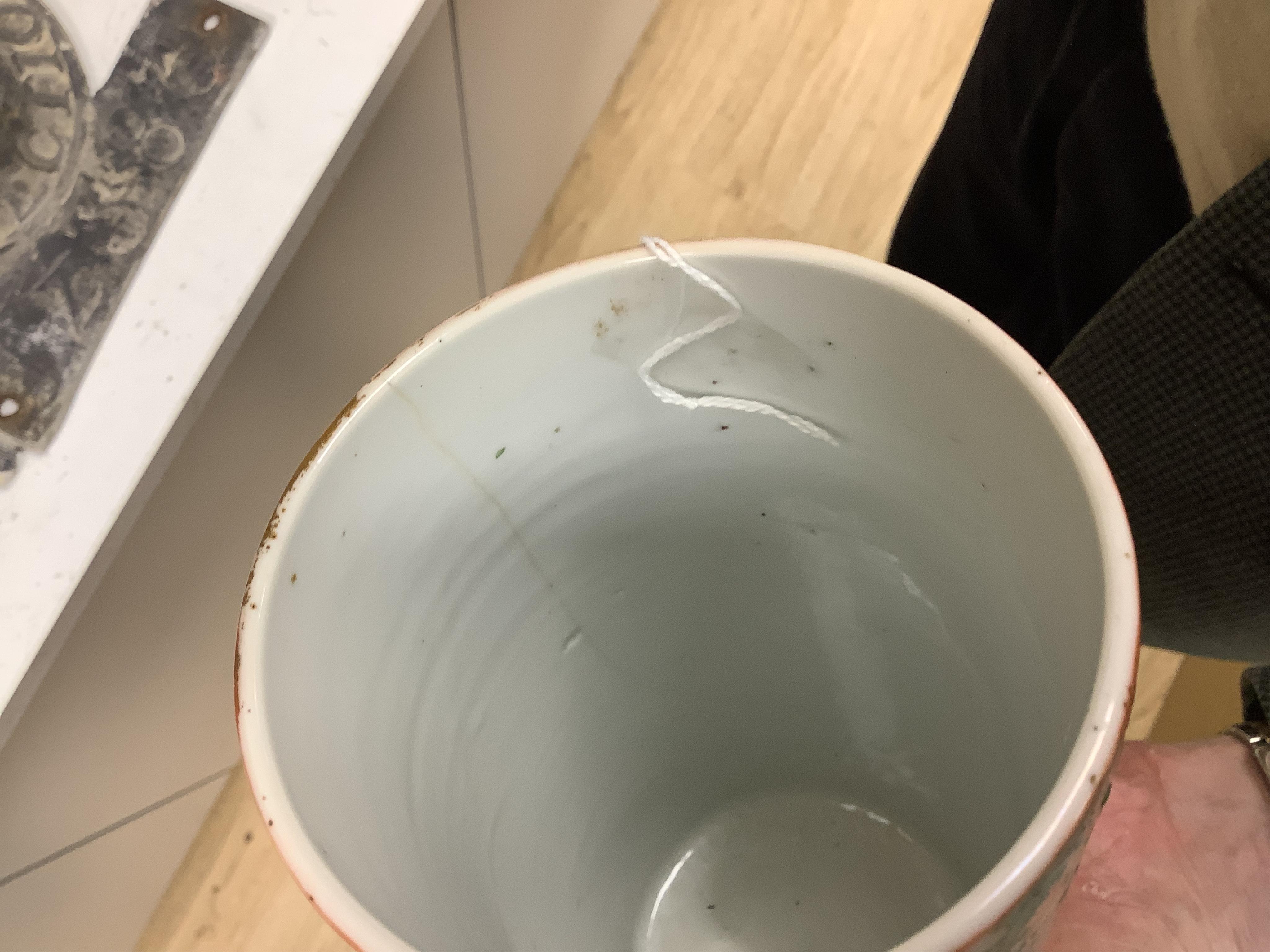 Two 19th century Chinese famille rose cylindrical vases and a similar bottle vase, 21cm